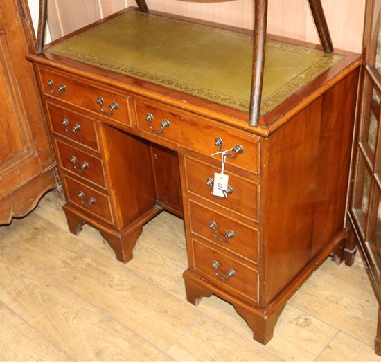 A George III style yew wood desk W.90cm